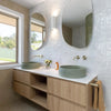 Timber vanity with twin basins, arched mirror and Meir brass-toned tapware