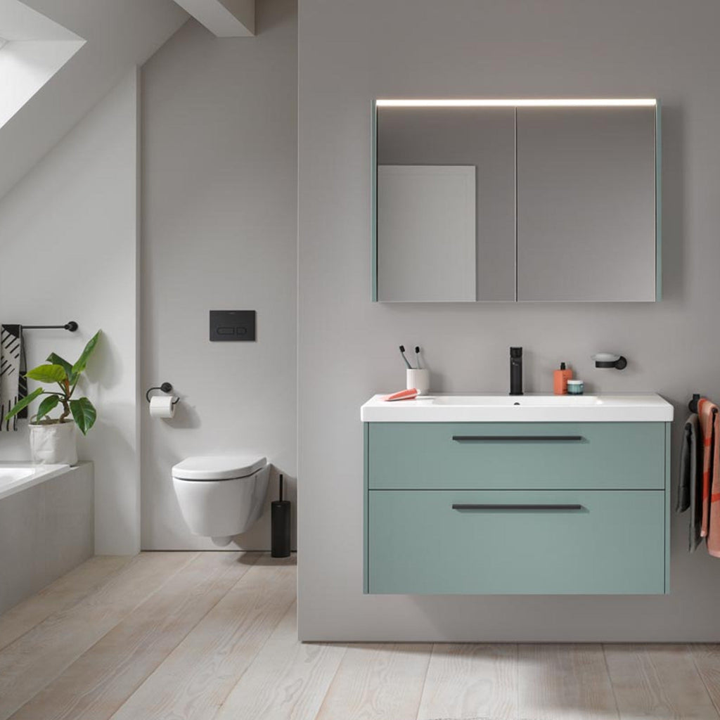Wall-hung two-drawer vanity unit with integrated basin, mirror cabinet and wall-hung toilet in a modern bathroom