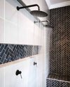 Blutide black rain shower heads and concealed shower mixers in a tiled walk-in shower