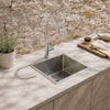 Meir stainless steel sink with a gooseneck mixer on a stone benchtop