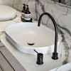 White vessel basin on a marble countertop with a tall Meir black basin mixer