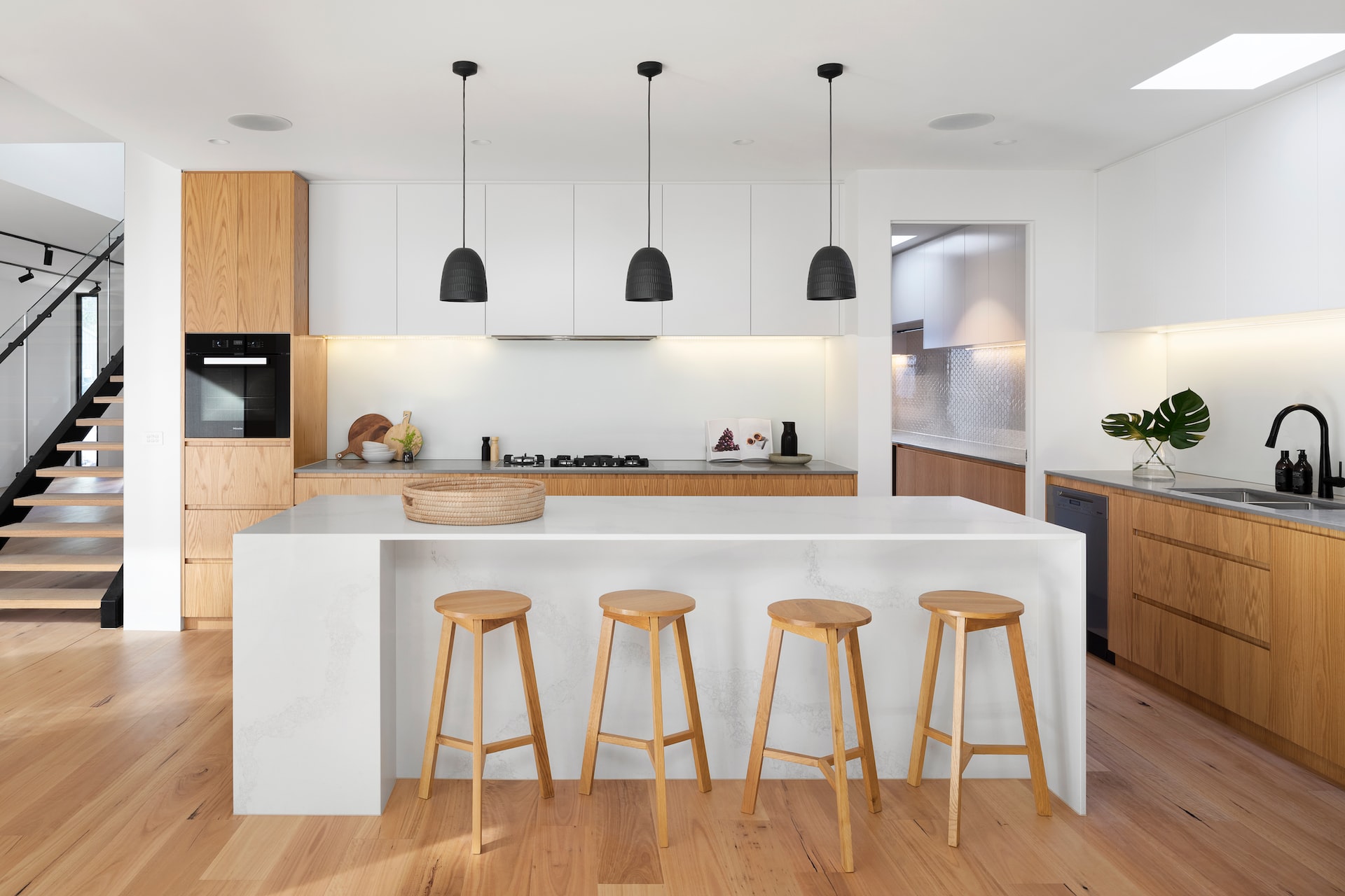 Modern kitchen design with wood undertones